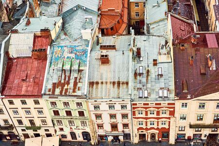 Lviv, Ukraine - May 20, 2019: View of the old Lviv. Bright color roofs of houses in historical city center.のeditorial素材