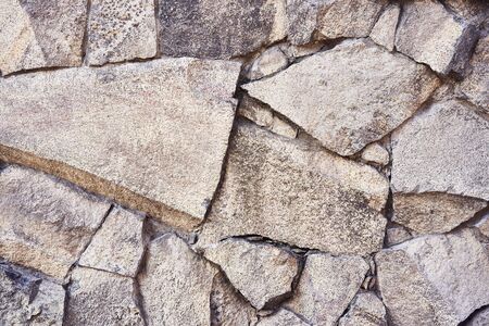Background stone texture. Hard old painted wall in grunge style. Surface for design and text. Close up view.の写真素材