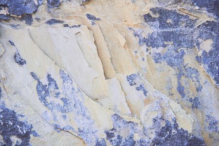 Background stone texture. Hard old painted wall in grunge style. Surface for design and text. Close...
