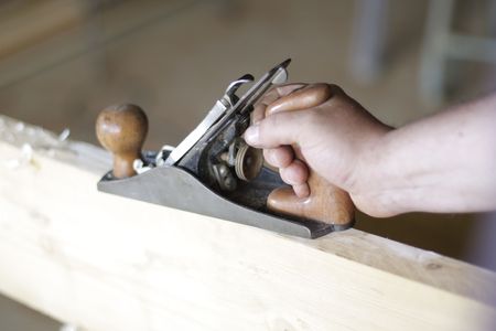 manual planer on a wood plankの写真素材