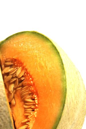 part of cantaloupe isolated on whiteの写真素材