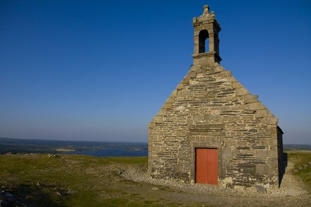 high hill in brittany with little churchの写真素材