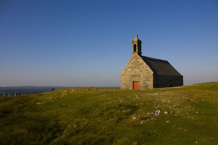high hill in brittany with little churchの写真素材