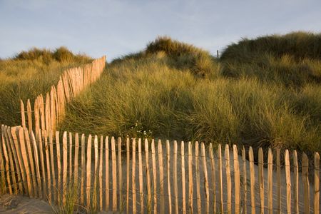 fences on a beach in brittany