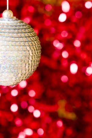 macro of a christmas ball in front of blur backgroundの写真素材
