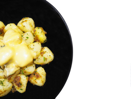 this is stir fried potatoes with butter on white  isolatedの写真素材