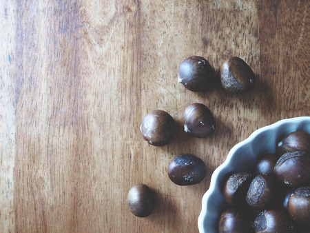 this is a chestnut on  woodenの写真素材