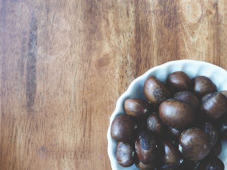 this is a chestnut on  woodenの写真素材
