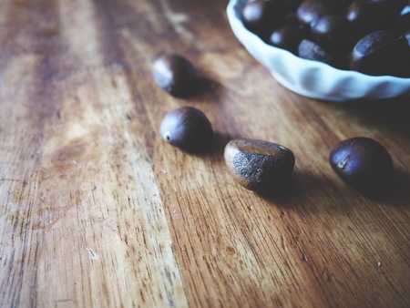 this is a chestnut on  woodenの写真素材