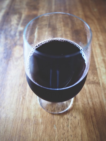 This is red grape juice on woodenの写真素材