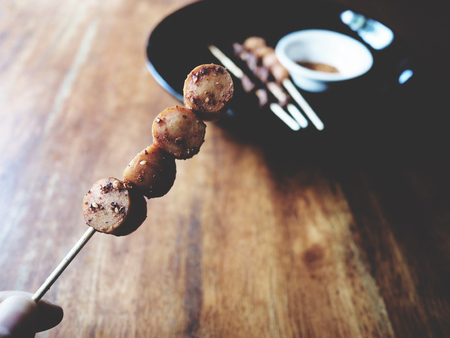 This is grilled sausage and pork intestine with spicy mala (Sichuan pepper)の写真素材