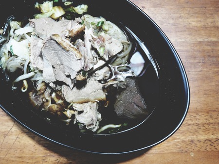 This is duck noodle in the  black bowlの写真素材