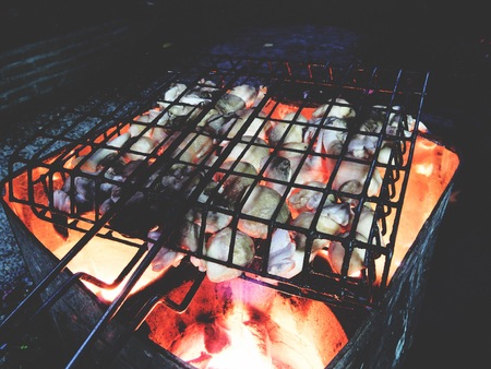 This is grilled straw  mushroom on charcoalの写真素材