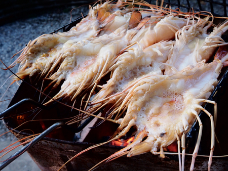 This is grilling prawns on charcoal at  home, homemadeの写真素材