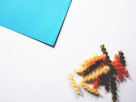 It's time to cook, The picture of multicolored of dried fusilli consist of yellow, orange and green on white background.  soft tone colorの写真素材