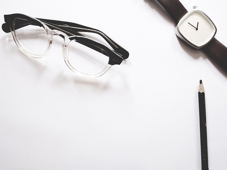 This is office equipment in minimal style, The picture of pen, glasses and watch on white background. soft tone color,  minimal styleの写真素材