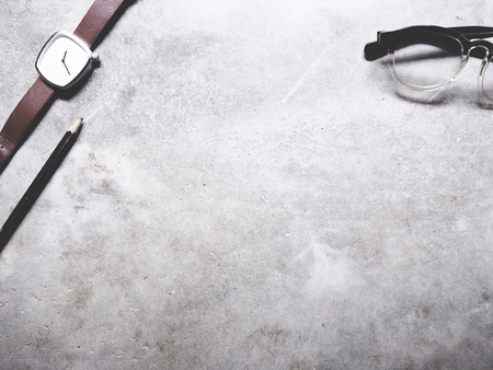 This is office equipment in minimal style, The picture of pencil, glasses and watch on cement background. soft tone color,  minimal styleの写真素材