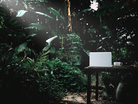 Businesses happen everywhere, just have inspiration. The picture of white laptop, a coffee cup and a...