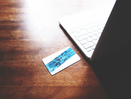 proceeding an online Financial Transactions with credit card and white laptop. Online Financial Transactions concept. selective focusの写真素材