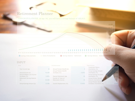 Retirement planning graph on workplace background. Retirement planning concept.の写真素材