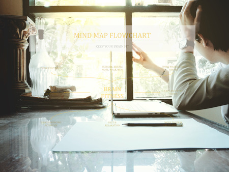 Brain fitness mind map flow chart on workplace background. keep your brain fit conceptの写真素材