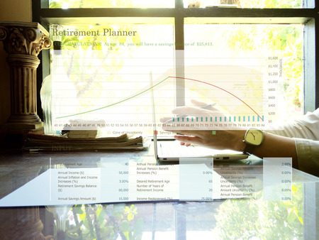Retirement planning graph on workplace background. Retirement planning concept.の写真素材