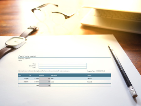The picture of meeting agenda form on workspace background. Financial management conceptの写真素材