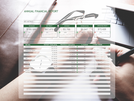 The picture of Annual financial report form on workspace background. Financial management concept.の写真素材