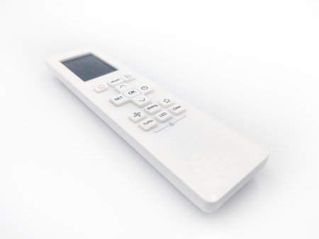 White AC remote control close up photoshoot isolated on white background