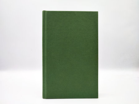 Plain green book hardcover mockup closeup photoshoot on white background.の写真素材
