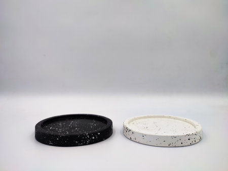 Black and white drink coasters isolated on white backgroundの写真素材