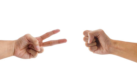 Rock beats scissor hand gesture isolated on white backgroundの写真素材