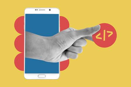 Hand coming out of phone holding button with coding symbol. Futuristic smartphone interface. Mobile app development concept. It engineer and programmer job.の写真素材