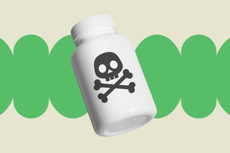 White bottle with skull label, green background, concept of danger, chemical risk, toxic packaging.の写真素材