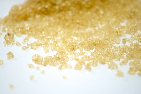 Spilling of Brown sugar on white blackgroundの写真素材
