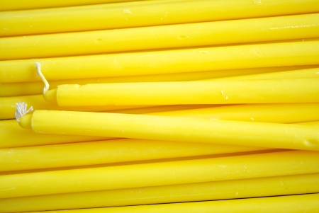 Group of Yellow candle and candlewicks as a backgroundの写真素材