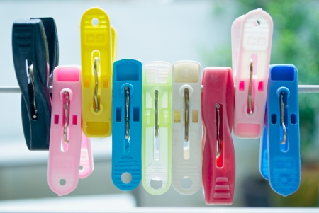 Colourful clothespins on a clothesline in yardの写真素材