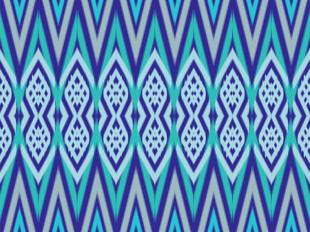 Ikat pattern as ethnic fabric. Design for fabric, background, wallpaper, vector, carpet, traditional fabric in blue tone. Wallpaper in seamless pattern design. Native design in geometric pattern.の写真素材