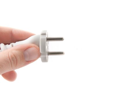 A Hand holding a power cable. Isolatedの写真素材