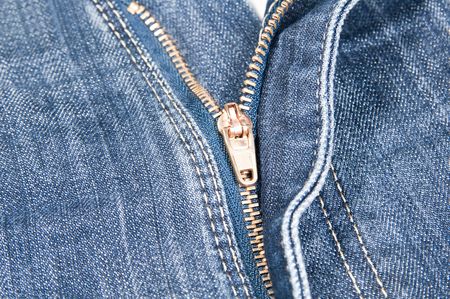 Closeup of a zipper on a pair of blue 