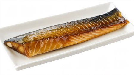 smoked mackerel on a plate isolated on a white backgroundの素材