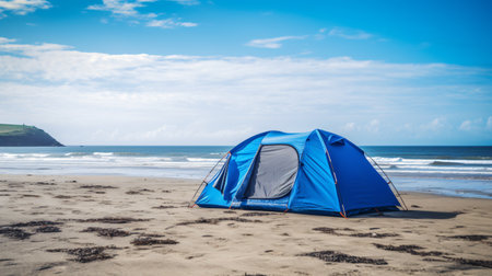 Camping on the beach with blue tent in a sunny day.の素材