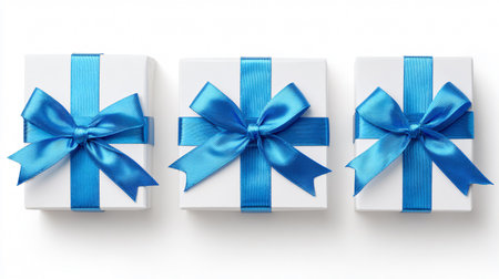 Elegant White Gift Boxes with Blue Ribbon Top View Display for Celebratory Occasionsの素材