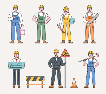 Worker character at construction site. Construction workers in various positions stand with their own tools. flat design style minimal vector illustration.のイラスト素材