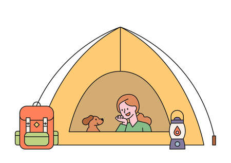 A woman is camping with her dog. The woman and the dog are resting in the tent. flat design style minimal vector illustration.のイラスト素材