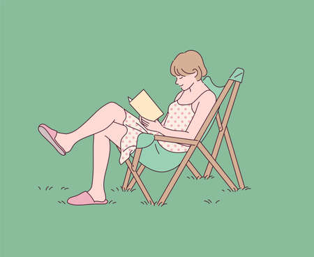 A girl is reading a book with a chair on the lawn.のイラスト素材