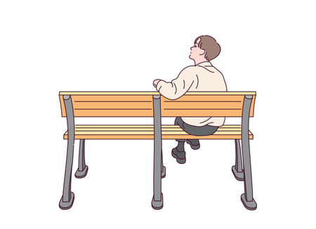 A man is sitting on bench alone.のイラスト素材