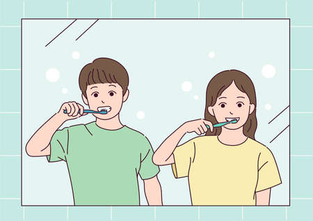 A boy and a girl brushing their teeth.のイラスト素材