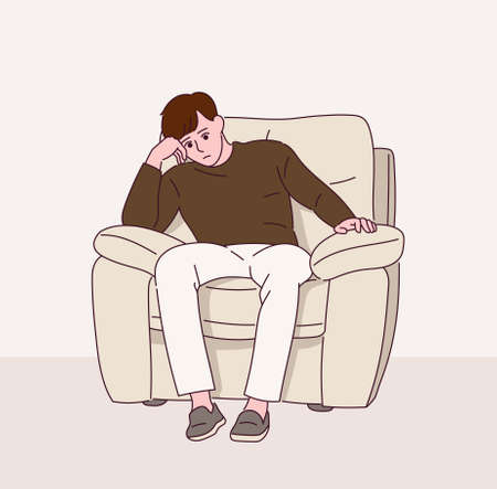 A man is pensive sitting on the sofa.のイラスト素材