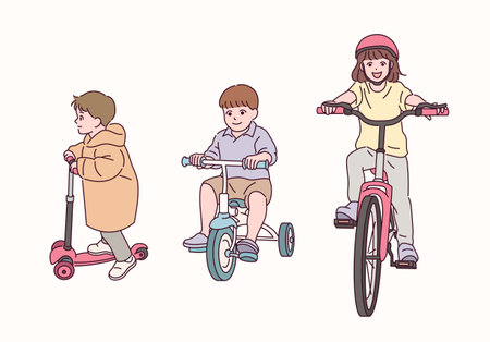Cute children riding bicycles.のイラスト素材